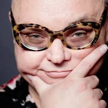 Portrait of a designer in tortoiseshell glasses